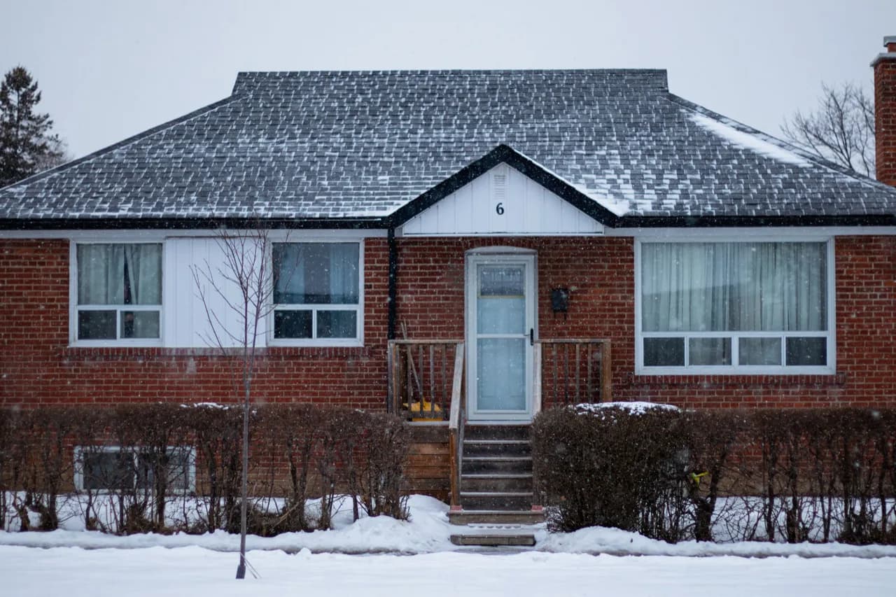 A classic red-brick North York bungalow in winter, the housing stock behind most ADU projects - ADU builders serving North York, Ontario, Canada