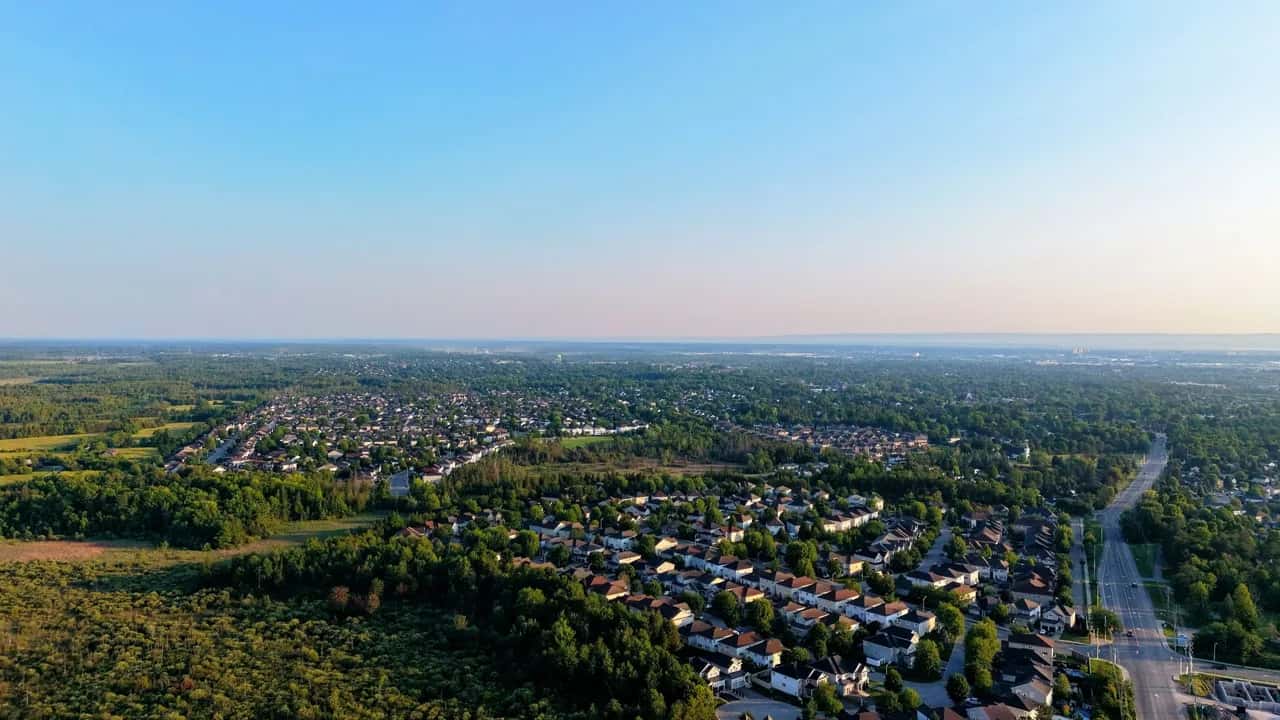 Aerial view of Uxbridge, a small town of tree-lined streets surrounded by greenbelt countryside - ADU builders serving Uxbridge, Ontario, Canada